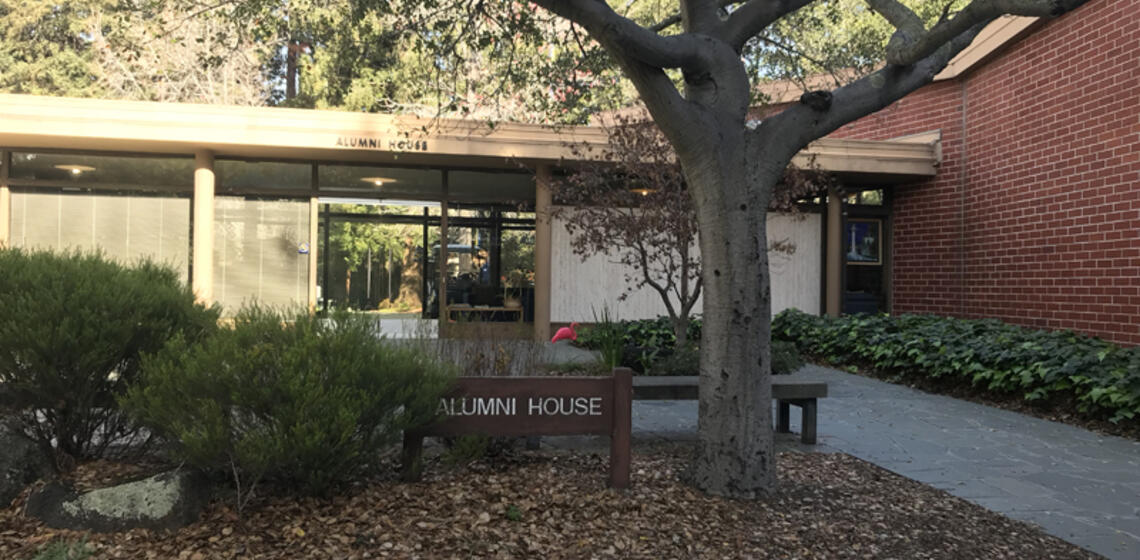 The south side of the Alumni House. The access path that leads to the main entrance is to the right of the building's courtyard.