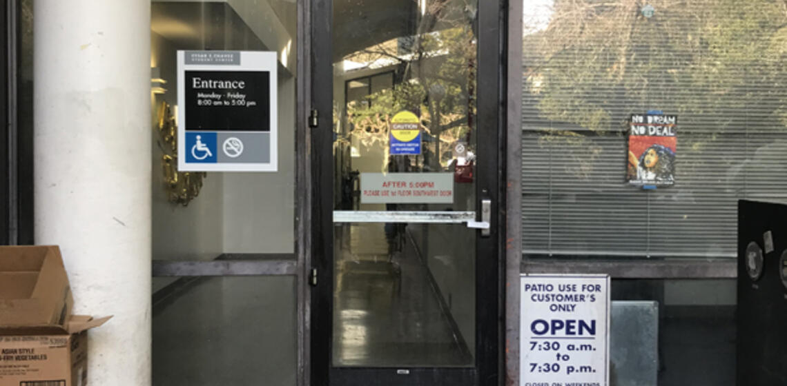 The east entrance to Cesar Chavez. To the right of the entrance is an automatic door opener.