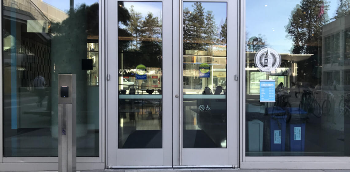The north entrance to Eshleman Hall. To the left of the doors is an automatic door opener.