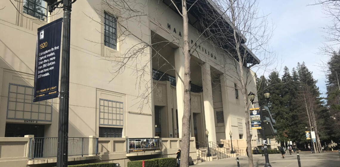 The front side of Haas Pavilion, facing east. In front of the entrance is a small staircase. The access ramp is to the left.
