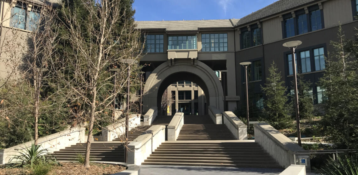 The front side of the Haas School of Business, facing west. The access path to the courtyard is a winding ramp on the right.