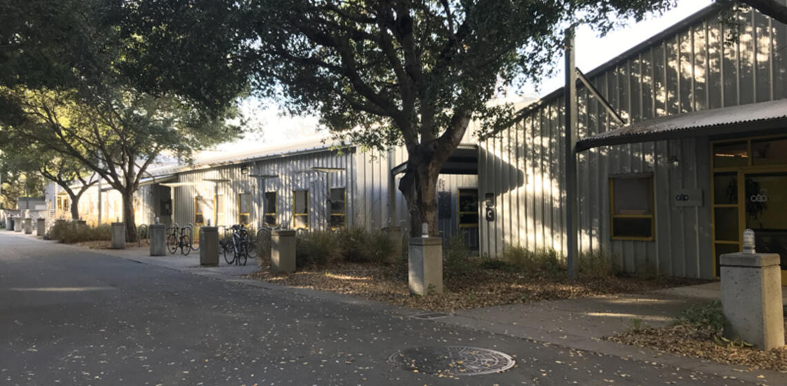 The east side of Hearst Field Annex. There are multiple small buildings with multiple entrances.