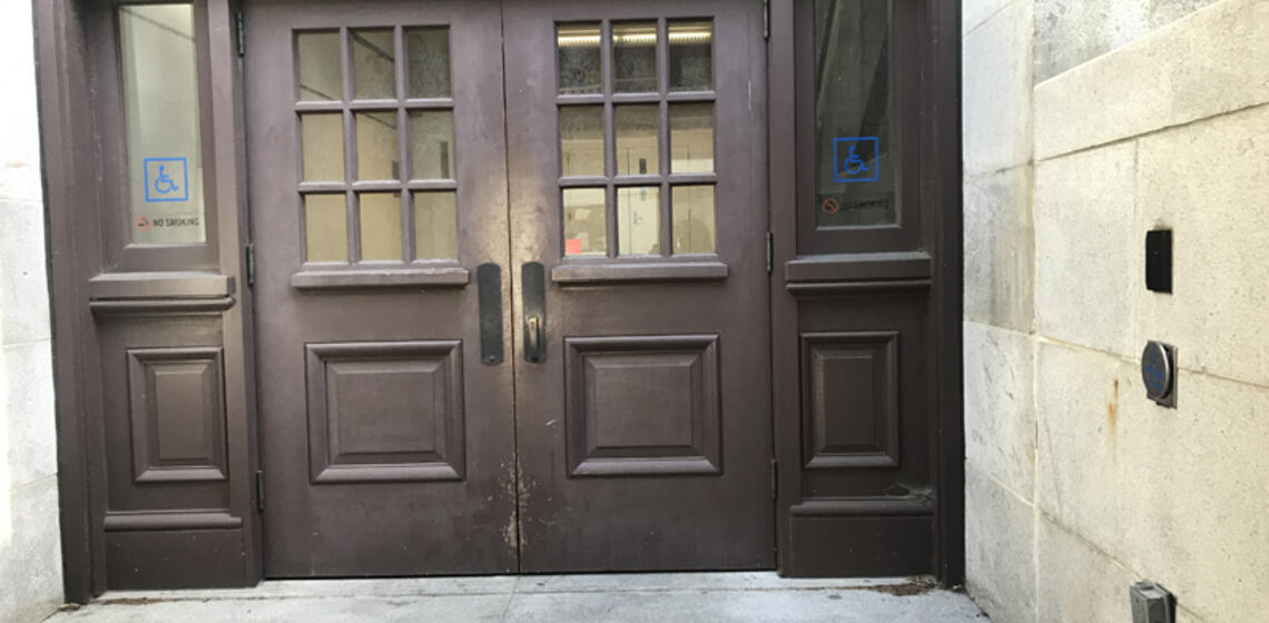 The accessible doors to Hearst Mining. To the right of the entrance is an automatic door opener.