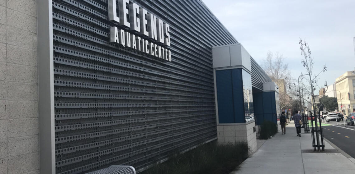 The front side of Legends Aquatic Center, facing north. The access path is a ramp to the right of the entrance's front stairs.