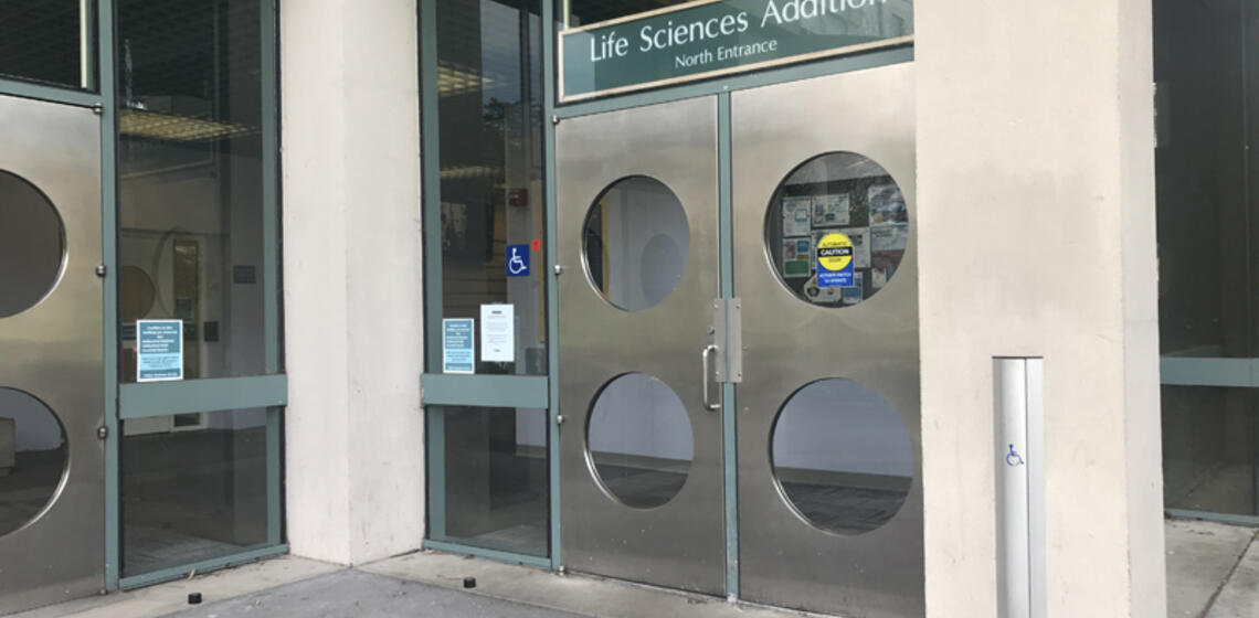 The main entrance to Life Sciences Addition, facing northeast. There are two sets of double doors. The rightmost doors have an a