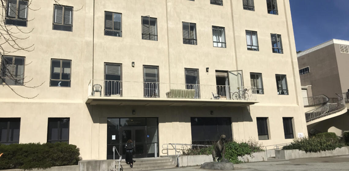 The south side of McCone Hall. The accessible path is a ramp on the right side of the entrance's stairs.