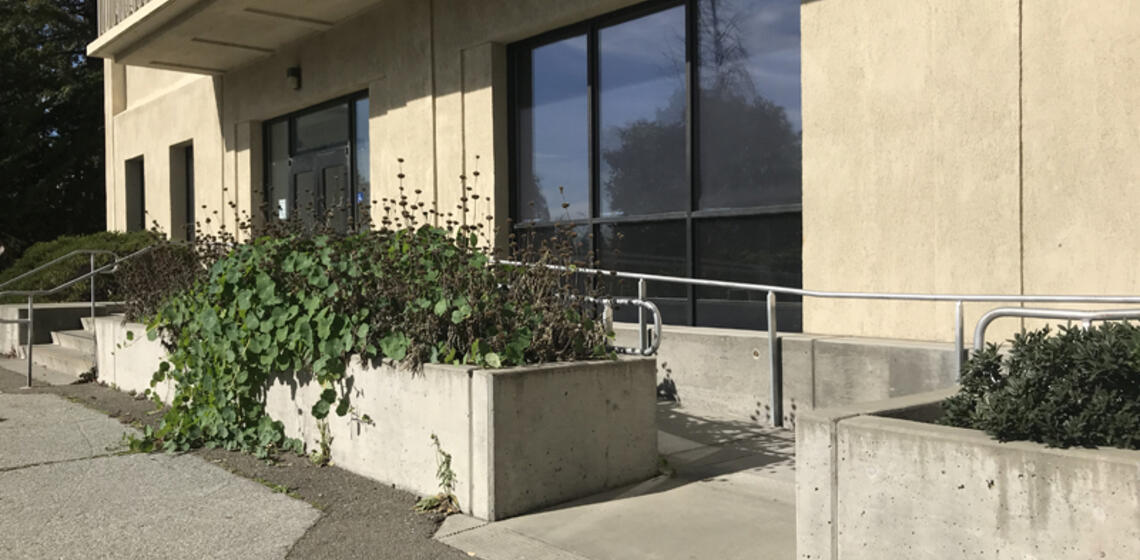 The south side accessible entrance to McCone Hall. The ramp is located to the right of the entrance's stairs.