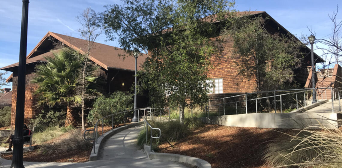 The south side of North Gate Hall. The accessible path is a ramp leading to the front courtyard of the building.