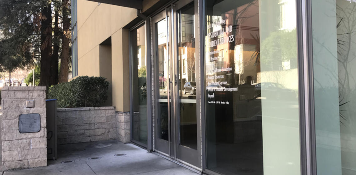 The main entrance to RSS, facing north. To the left of the entrance is an automatic door opener.