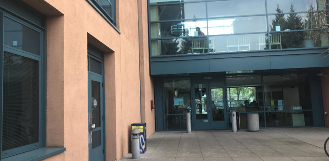 The north entrance to the Tang Center. To the right of the entrance is an automatic door opener.
