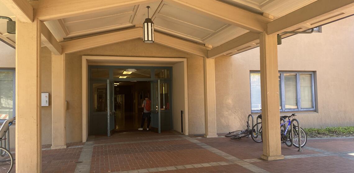 The main entrance to Morrison Hall, facing east. To the right of the entrance is an automatic door opener.