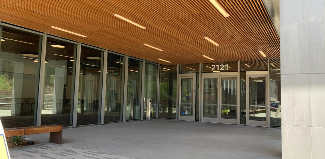 The southeast entrance to Berkeley Way West. To the left of the leftmost set of doors is an automatic door opener.
