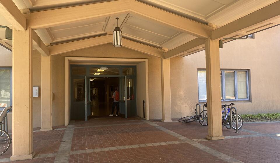 The main entrance to Morrison Hall, facing east. To the right of the entrance is an automatic door opener.