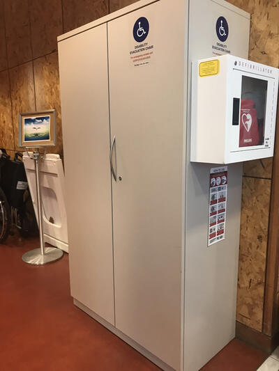 The evacuation chair for the Tang Center, located in the front lobby. It is situated in an evacuation cabinet. 